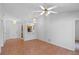 Open-concept living room featuring tile flooring and decorative lighting, seamlessly connected to the kitchen and dining area at 3220 Harpers Ferry Ct, Orlando, FL 32837