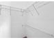 Walk-in closet with white wire shelving, designed for efficient storage and organization of clothing and accessories at 3220 Harpers Ferry Ct, Orlando, FL 32837