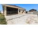 Backyard with concrete patio, screened-in patio, and side yard access at 4026 Ruby Run, Haines City, FL 33844