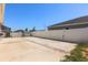 Backyard with a concrete patio, white fence, and some greenery at 4026 Ruby Run, Haines City, FL 33844
