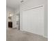 Bedroom with large closet, neutral carpet, and bathroom access at 4026 Ruby Run, Haines City, FL 33844