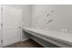 Functional laundry room featuring ample countertop space with overhead storage for convenience at 4026 Ruby Run, Haines City, FL 33844