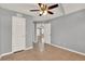 Large room with doors, ceiling fan, and neutral colors throughout at 420 Forestway Cir # 108, Altamonte Springs, FL 32701