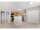 Well-lit kitchen with light wood cabinets, granite countertops, and stainless steel appliances at 420 Forestway Cir # 108, Altamonte Springs, FL 32701