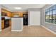 Bright kitchen features wood cabinets, a breakfast bar, and modern black appliances at 420 Forestway Cir # 108, Altamonte Springs, FL 32701