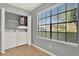 Bright laundry room with washer, dryer, and water heater next to a window at 420 Forestway Cir # 108, Altamonte Springs, FL 32701