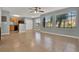 Spacious living room with tile flooring, a view of the kitchen, and natural light from large windows at 420 Forestway Cir # 108, Altamonte Springs, FL 32701