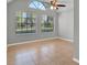 A bright room with neutral colors, ceiling fan, and large windows with blinds at 420 Forestway Cir # 108, Altamonte Springs, FL 32701