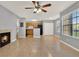 Open-concept living space showcasing tiled floors, a ceiling fan, and a view of the kitchen at 420 Forestway Cir # 108, Altamonte Springs, FL 32701