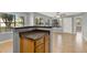 Open floor plan showcasing the kitchen's breakfast bar and the bright living room at 420 Forestway Cir # 108, Altamonte Springs, FL 32701