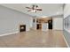 Bright living room offering a fireplace, open layout, and views of the kitchen and a bathroom at 420 Forestway Cir # 108, Altamonte Springs, FL 32701