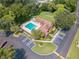 Aerial view of the community pool, clubhouse and parking area surrounded by mature trees and landscaping at 420 Forestway Cir # 108, Altamonte Springs, FL 32701