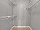 This walk-in closet features neutral walls and wire shelving at 420 Forestway Cir # 108, Altamonte Springs, FL 32701