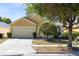 Inviting single-Gathering home features a two-car garage and well-maintained landscaping at 4579 Westgrove Way, Orlando, FL 32808