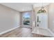 Bright foyer with a decorative window, a front door and durable tile flooring at 4579 Westgrove Way, Orlando, FL 32808