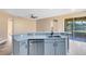 Modern kitchen with an island, stainless steel appliances and sliding glass doors overlooking lake at 4579 Westgrove Way, Orlando, FL 32808