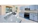 Modern kitchen with granite countertops, blue cabinets, and a view of the lake at 4579 Westgrove Way, Orlando, FL 32808