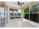 Relaxing screened lanai with ceiling fan provides scenic views of the adjacent pond at 4579 Westgrove Way, Orlando, FL 32808