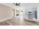 Open living space with access to the kitchen and a sliding glass door at 4579 Westgrove Way, Orlando, FL 32808