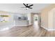 Bright living space featuring an open kitchen with stainless steel appliances at 4579 Westgrove Way, Orlando, FL 32808