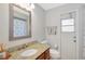 Bathroom featuring a granite vanity top, a toilet, and a shower with glass doors at 4833 Palm Tree Ct, Windermere, FL 34786