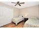 Bedroom with twin beds, a ceiling fan, and a closet at 4833 Palm Tree Ct, Windermere, FL 34786