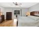 Bright bedroom with a ceiling fan and a sliding glass door leading to the outside pool area at 4833 Palm Tree Ct, Windermere, FL 34786