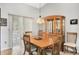 Inviting dining area with a wooden table and chairs, adjacent to sliding doors for natural light at 4833 Palm Tree Ct, Windermere, FL 34786