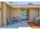 Inviting front porch with seating area and a well-maintained landscape at 4833 Palm Tree Ct, Windermere, FL 34786