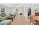Bright living room featuring tile floors, neutral walls, and comfortable seating arrangement at 4833 Palm Tree Ct, Windermere, FL 34786