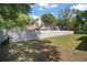 A spacious backyard with a privacy fence and lush lawn, perfect for outdoor activities at 510 Fahnstock St, Eustis, FL 32726