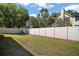 A spacious backyard with a privacy fence and lush lawn, perfect for outdoor activities at 510 Fahnstock St, Eustis, FL 32726