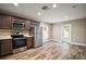 Eat-in kitchen featuring stainless steel appliances, tile flooring, and access to backyard at 510 Fahnstock St, Eustis, FL 32726