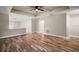Spacious living room featuring hardwood floors, recessed lighting and views of kitchen at 510 Fahnstock St, Eustis, FL 32726