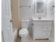 A clean bathroom with white fixtures, including a toilet, vanity, and shower/tub at 5518 Cretan Way, Winter Park, FL 32792