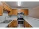 Efficient kitchen with stainless steel appliances and neutral countertops at 5518 Cretan Way, Winter Park, FL 32792