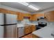 Well-equipped kitchen with stainless steel appliances and ample cabinet space at 5518 Cretan Way, Winter Park, FL 32792