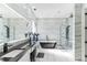 Primary bathroom boasts double vanity, statement tub and glass shower at 5531 Dallas Blvd, Orlando, FL 32833