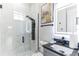 Modern bathroom featuring a glass shower, LED mirror, and stylish black fixtures at 5531 Dallas Blvd, Orlando, FL 32833
