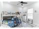 Bright, cheerful bedroom features a bunk bed, fun decor and a large window at 5531 Dallas Blvd, Orlando, FL 32833