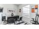 Office has carpet flooring, abstract art, and a window with a view at 5531 Dallas Blvd, Orlando, FL 32833