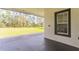 Covered patio provides a perfect outdoor retreat with views of the large backyard at 5531 Dallas Blvd, Orlando, FL 32833