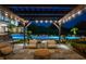 Backyard patio featuring an outdoor seating area, a pergola with string lights, landscaping, and a swimming pool at 570 Manor Rd, Maitland, FL 32751