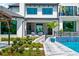 Well manicured backyard with a pool, walkway, and outdoor seating spaces at 570 Manor Rd, Maitland, FL 32751