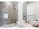 Updated bathroom features a shower-tub combination and white marble countertops and a sleek design at 570 Manor Rd, Maitland, FL 32751
