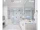 Luxurious primary bathroom with a soaking tub, glass shower, double vanity, and modern design at 570 Manor Rd, Maitland, FL 32751