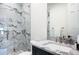 Stylish bathroom with dual shower heads, a spacious vanity and bright natural light at 570 Manor Rd, Maitland, FL 32751