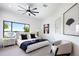 Bedroom features soft carpet, a modern ceiling fan, and a serene view of the lake at 570 Manor Rd, Maitland, FL 32751