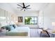 Bright bedroom with large window showcasing the scenic water views, and neutral modern decor at 570 Manor Rd, Maitland, FL 32751