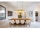 Elegant dining room with modern lighting, a large table, and seating for eight at 570 Manor Rd, Maitland, FL 32751